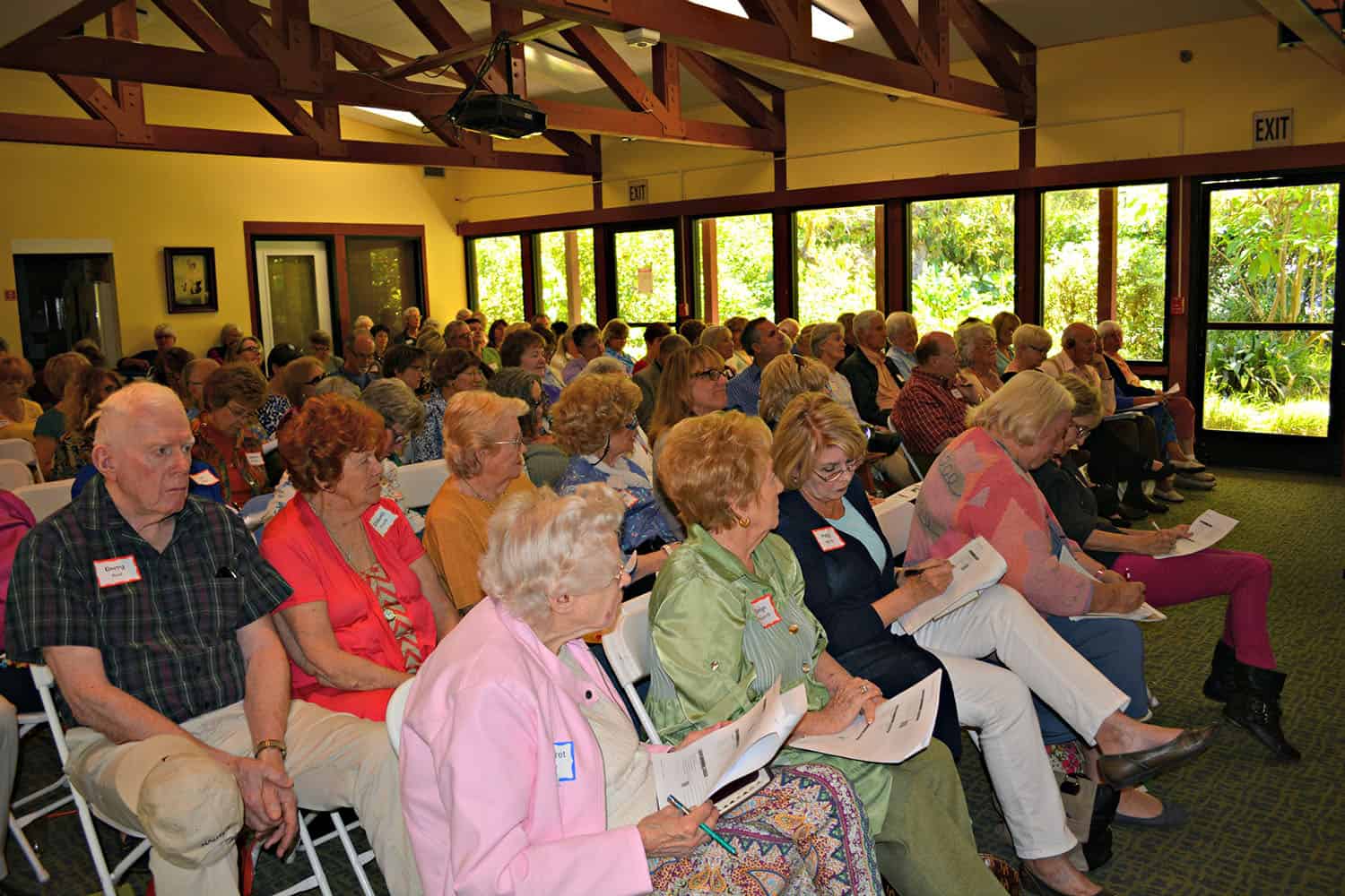 Rows of Psalms workshop attendees read handouts in the meeting room.