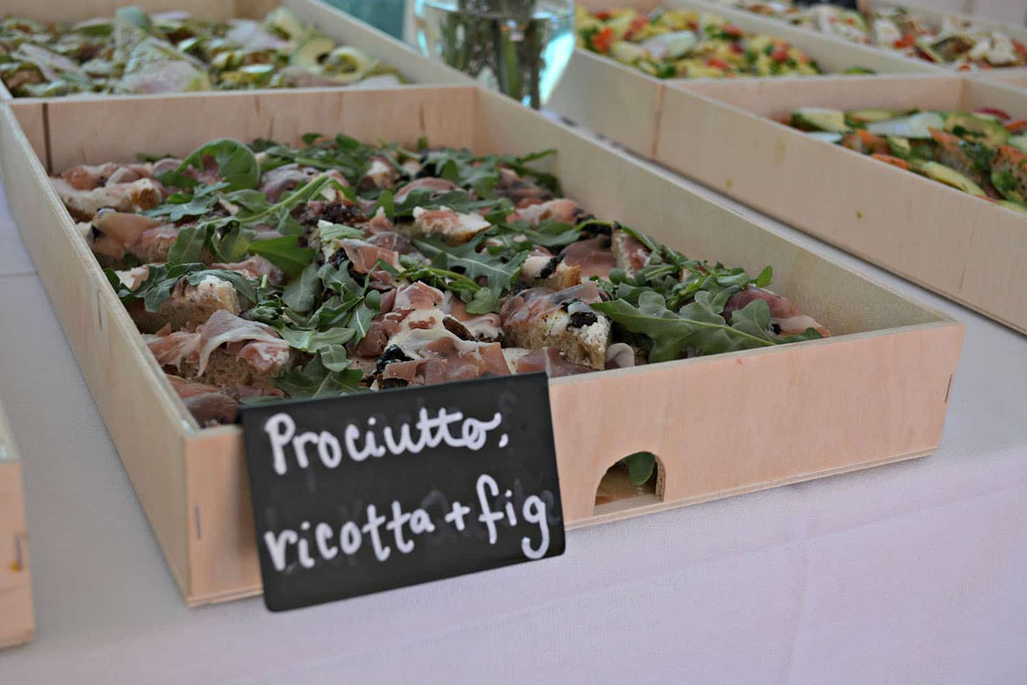 A tray of prosciutto, ricotta, and fig sandwiches at the volunteer lunch.